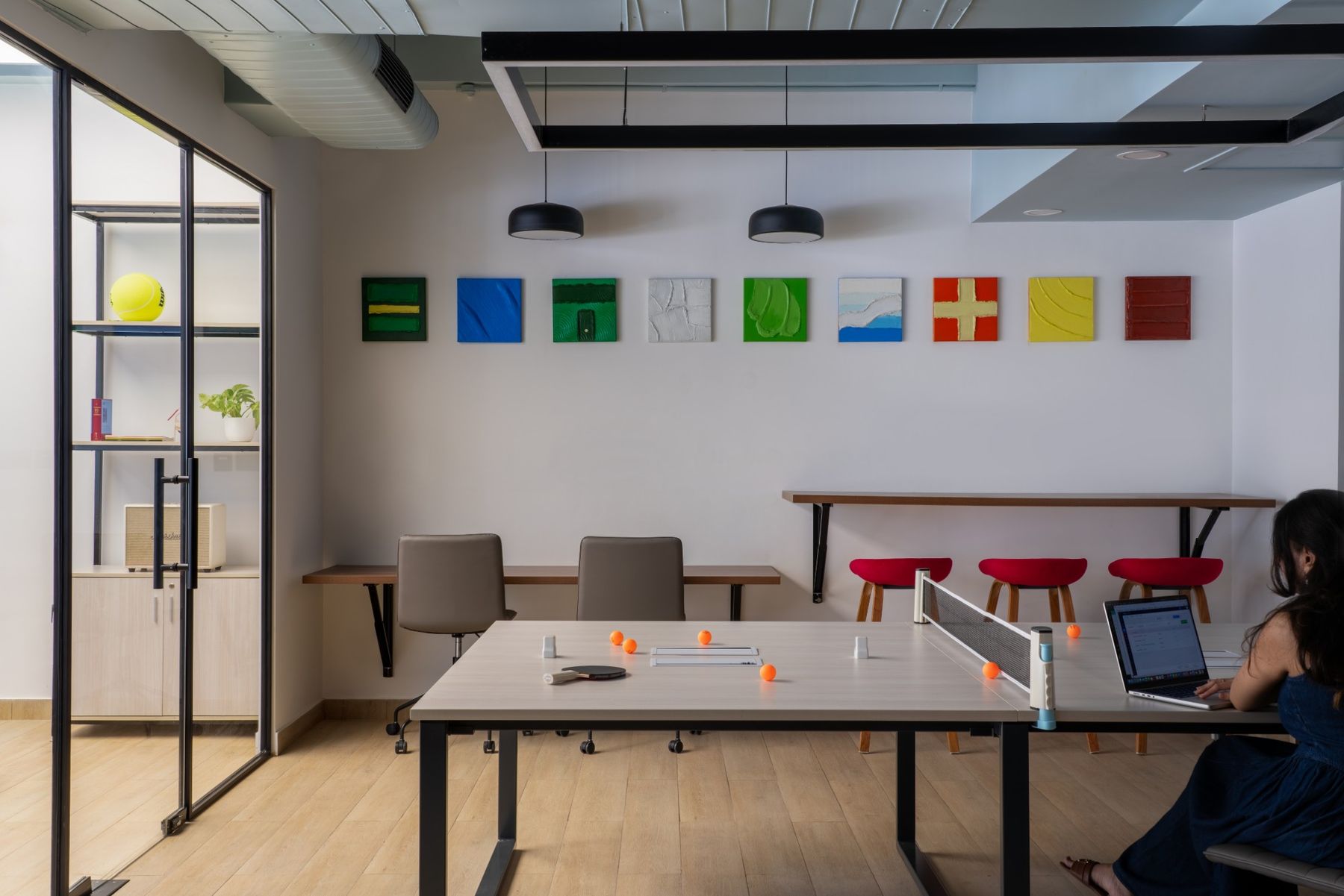 Studio with the art wall and a table-tennis table